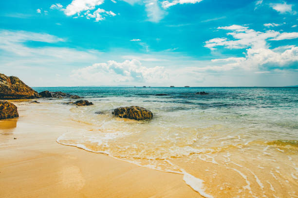 Idyllic beach on a tropical island in Thailand seen a hot summer day.