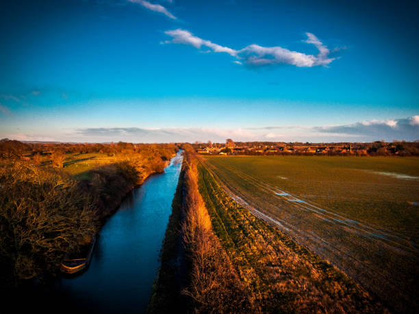 istock Chichester Canal with hunston in background 1207573058