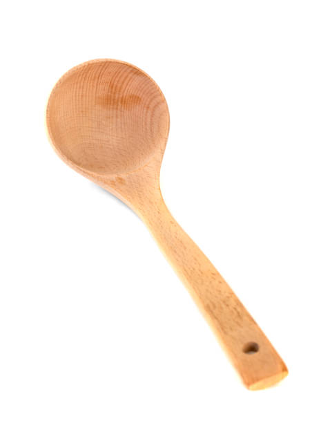 istock Wooden kitchen spoon isolated on white background 1207573595