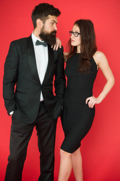 Official event concept. Man bearded wear tuxedo girl elegant dress. Formal dress code. Visiting event or ceremony. Couple classy clothes. Elite event. Main rules picking clothes. Corporate party Official event concept. Man bearded wear tuxedo girl elegant dress. Formal dress code. Visiting event or ceremony. Couple classy clothes. Elite event. Main rules picking clothes. Corporate party. dinner jacket stock pictures, royalty-free photos & images
