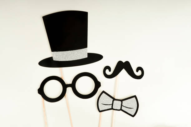 istock Fun and carnival concept, paper masks held in hands 1207575973