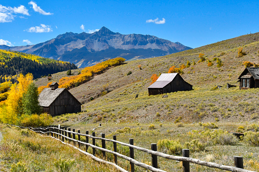 Fall colors with old wood buildings on San Juan Skyway.