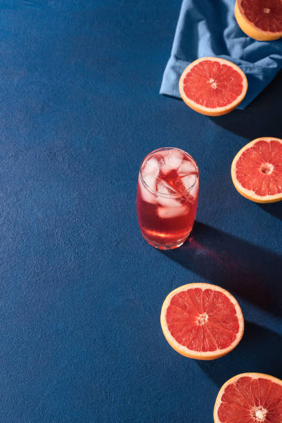 istock Grapefruit drink and slices citrus fruits. Grapefruit halves 1207577515
