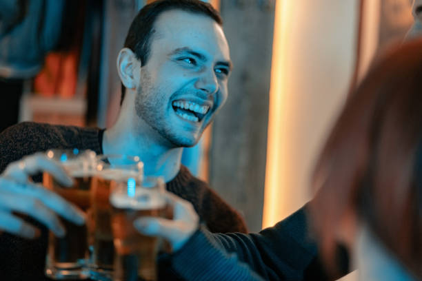 istock Happy friends toasting with beer 1207578166
