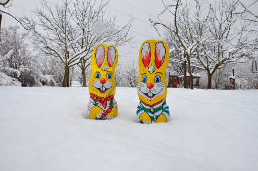 Ceramic white hares, vintage figurine on a white background