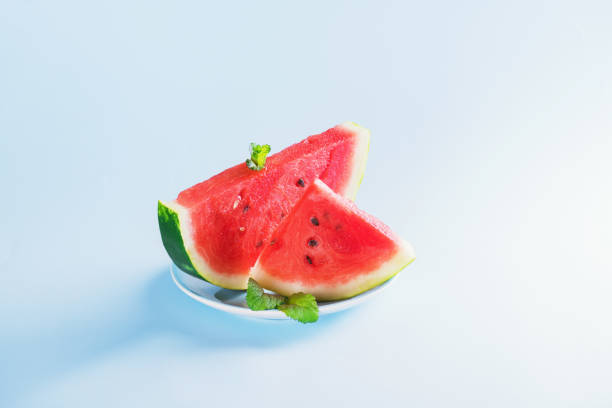 istock Watermelon slice on light blue background. Summer concept 1207581271