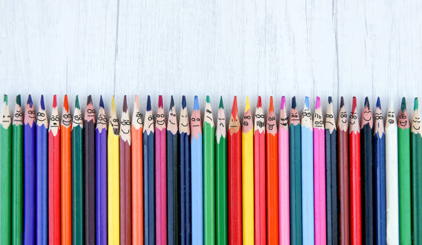 brushes in a row with faces and funny grimace - color image photography crayon art imagens e fotografias de stock