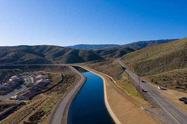 California Aqueduct The California Aqueduct flows in Palmdale, California, near Godde Hill Road. canal stock pictures, royalty-free photos & images