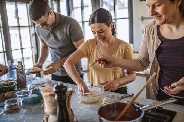istock Group of friends preparing pizza 1207587628