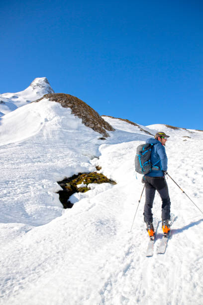 istock man looking the way skiing in a sport day 1207596097