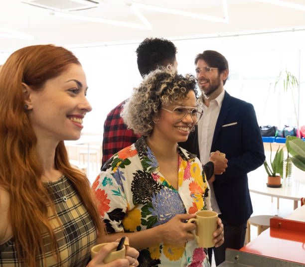 istock Coffee break in co-working business team 1207598932
