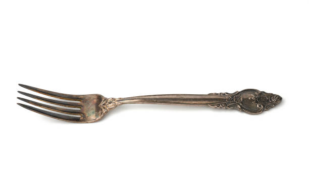 istock metal vintage fork isolated on white background 1207599861