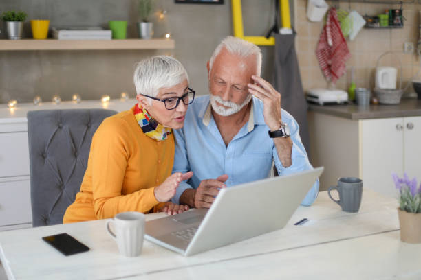 istock Senior couple shopping online. 1207606308