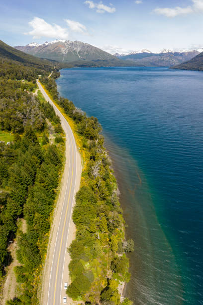istock Bariloche road by lake, mountain range with snow, Argentina 1207607165