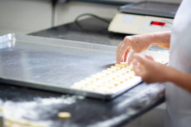istock Woman preparing food in a bakery 1207610070