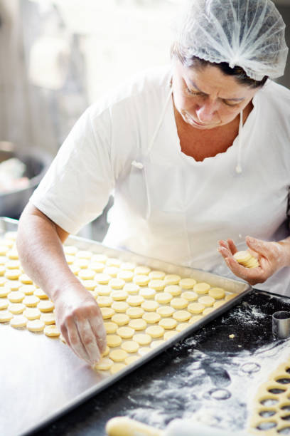 istock Woman preparing food in a bakery 1207610955