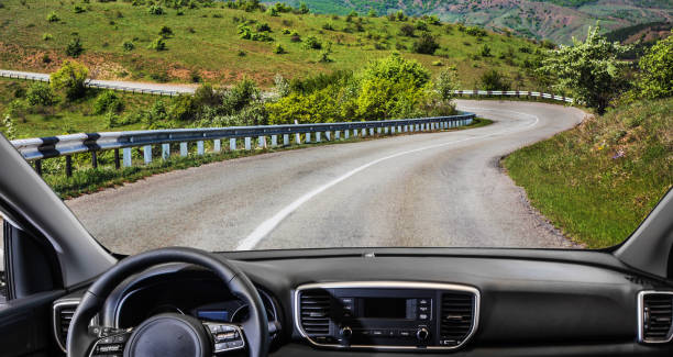 istock car going on the mountain road 1207617963