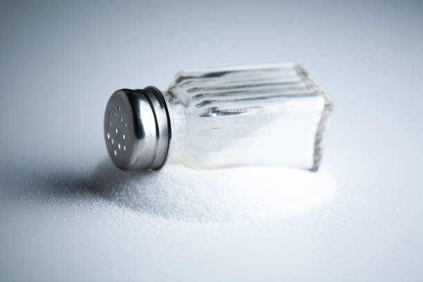 photograph of Vintage Salt Shaker on White Background with Shadows