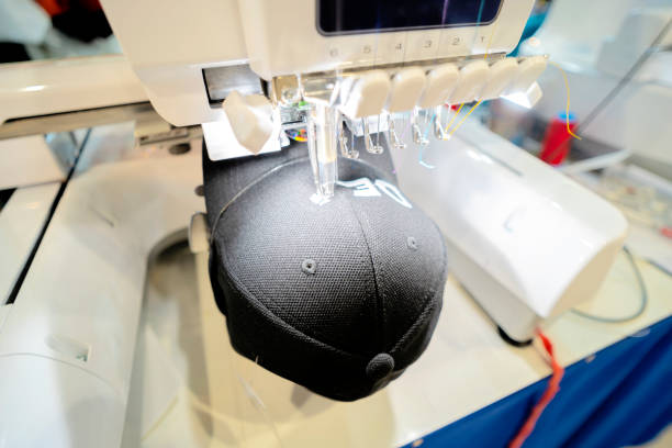 Computerized embroidery machines. Close up picture workspace of embroidery machine stitching a logo