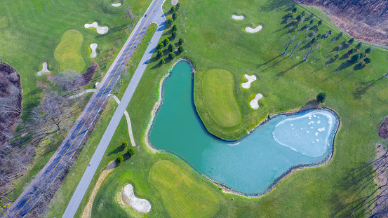 Golf course with high quality lawn and lakes. Mezhigorye National Park. View from the drone.