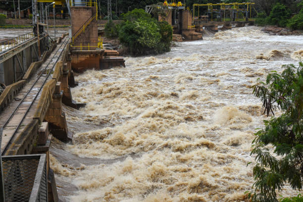 istock river topping floodgates with muddy waters 1207631392