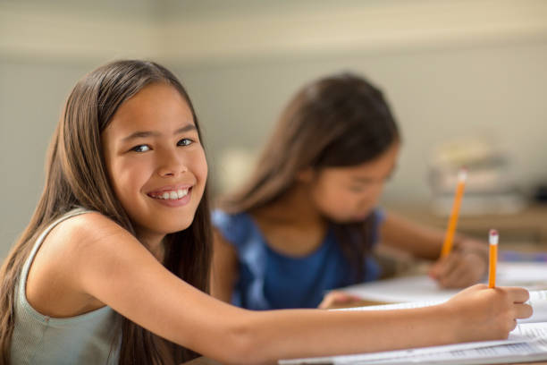 istock Young Girls Working On Their School Work 1207640493