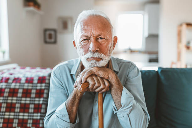 istock Elderly man sitting alone at home 1207644014