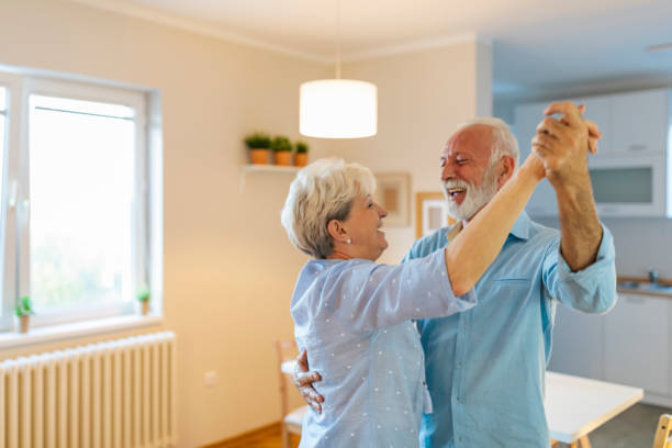 istock Couple dancing at home 1207644215