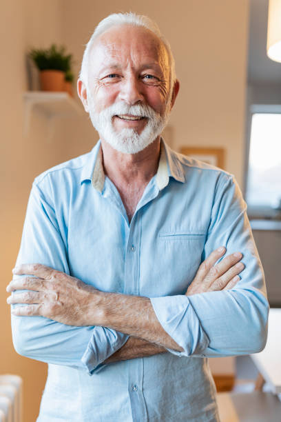 istock Smiling active senior with arms crossed 1207644271