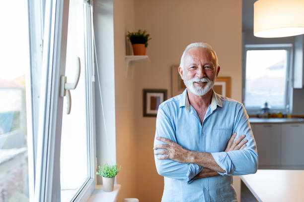 istock Smiling active senior with arms crossed 1207644286