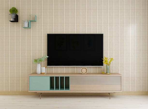 istock Spacious living room interior design with sofa, table, TV, green plants 1207651109