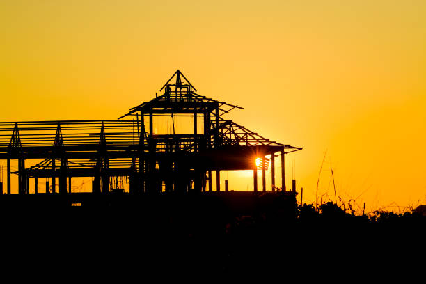 backlit image of building construction site work from concrete, concrete structure of building under construction, concrete formwork, construction of the building, building construction site work against backlit