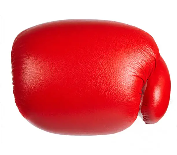 Red professional boxing glove isolated on white background, front view. Close up.