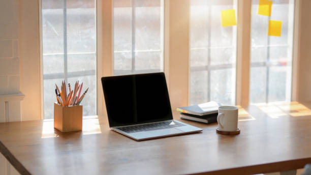 istock Cropped shot of simple workplace next to window 1207660266