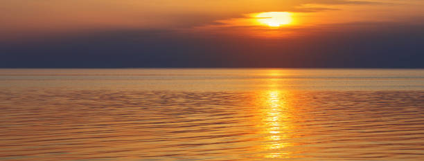 istock beautiful summer sunset on sea 1207665434