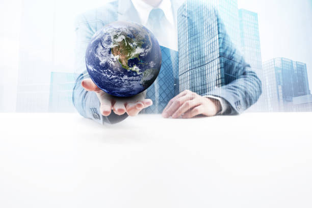Businessman Holding a Planet Earth on His Palm of Hand.