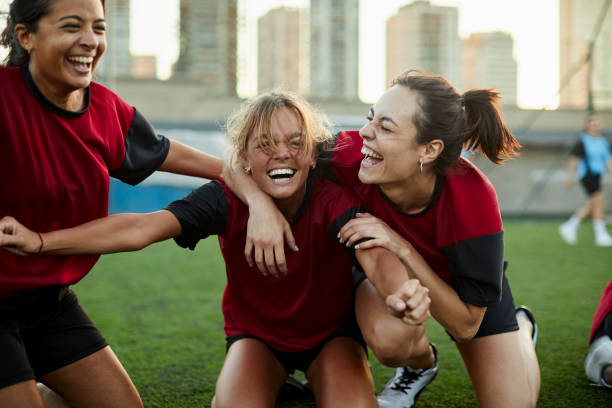 striker celebrates a goal with her team mates. - sportsman competitive sport professional sport team sport imagens e fotografias de stock