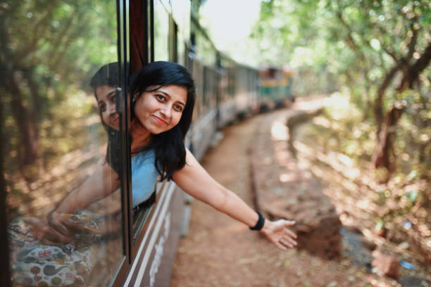 istock Woman travelling by tourist train 1207665871