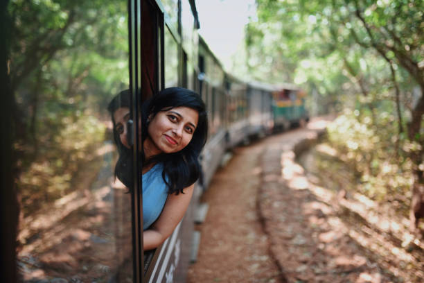 istock Woman travelling by tourist train 1207665881