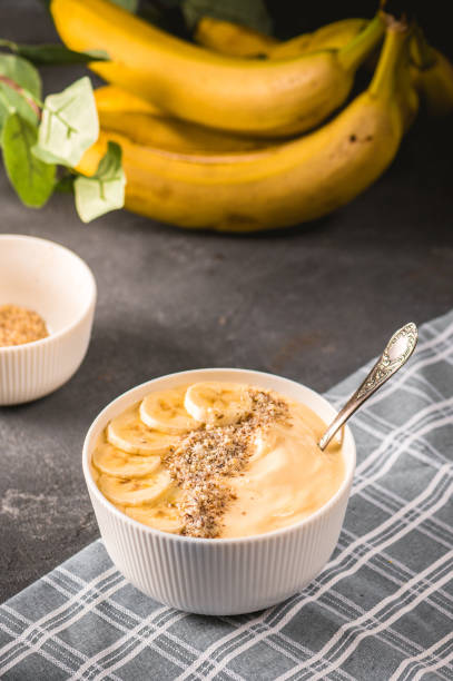istock Healthy pineapple, mango smoothie bowl with banana 1207665891
