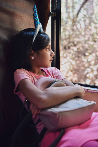 istock Girl (6-7 years) travelling by the miniature train 1207667493