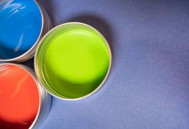 Primary colors in acrylic paint in metal tins still life art supply