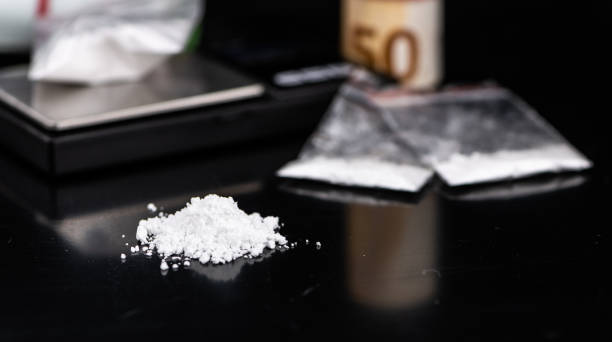 istock Portion of Cocaine on a dark plate (close-up) 1207674006