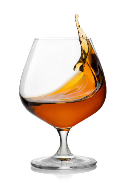 istock splash of brandy in snifter glass 1207674038