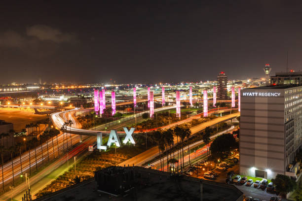 LAX Los Angeles International Airport Sign and pylons at Night stock photo