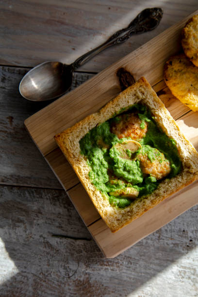 istock homemade breakfast:bread bowl with meatball and spinach smash sauce 1207674251