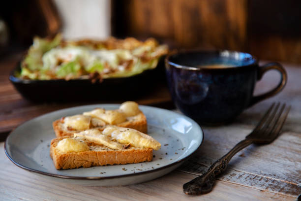 istock home cooking:baked salmon and cabbage, cheese toasted bread and coffee 1207674309