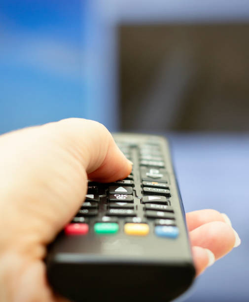 istock Remote control in hand. Smart tv. Tv remote control. 1207680256