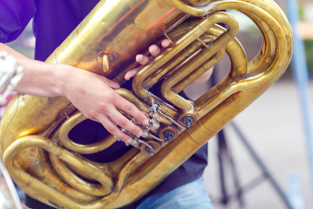 A tuba musician closeup in the city street stock photo