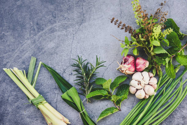 Natural fresh herbs and spice on black plate in the kitchen for ingredient food - kitchen herb garden concept